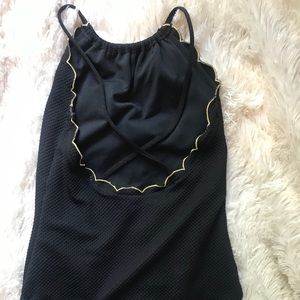 Black one piece with scalloped gold top